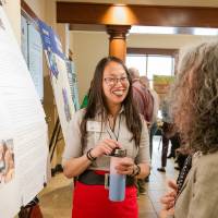 Angelina (left) happily explaining her research
